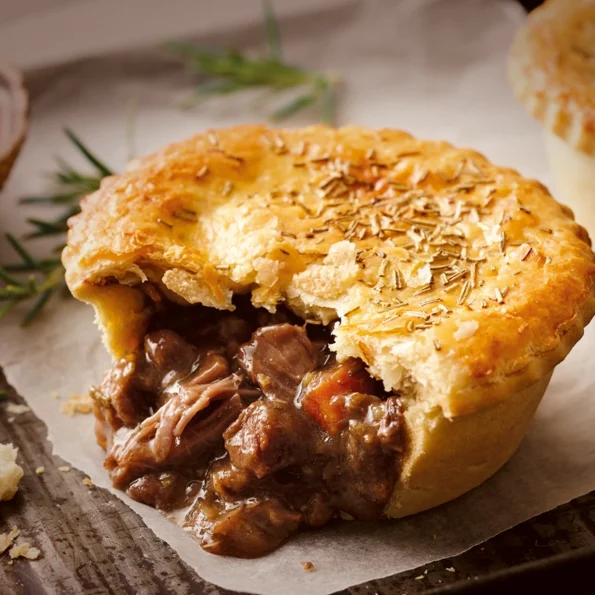 New Zealand meat pie, homemade Austrie Meat Pie with savory beef filling and flaky pastry, traditional Kiwi comfort food australian cuisine world cuisine recipes aussie cuisine