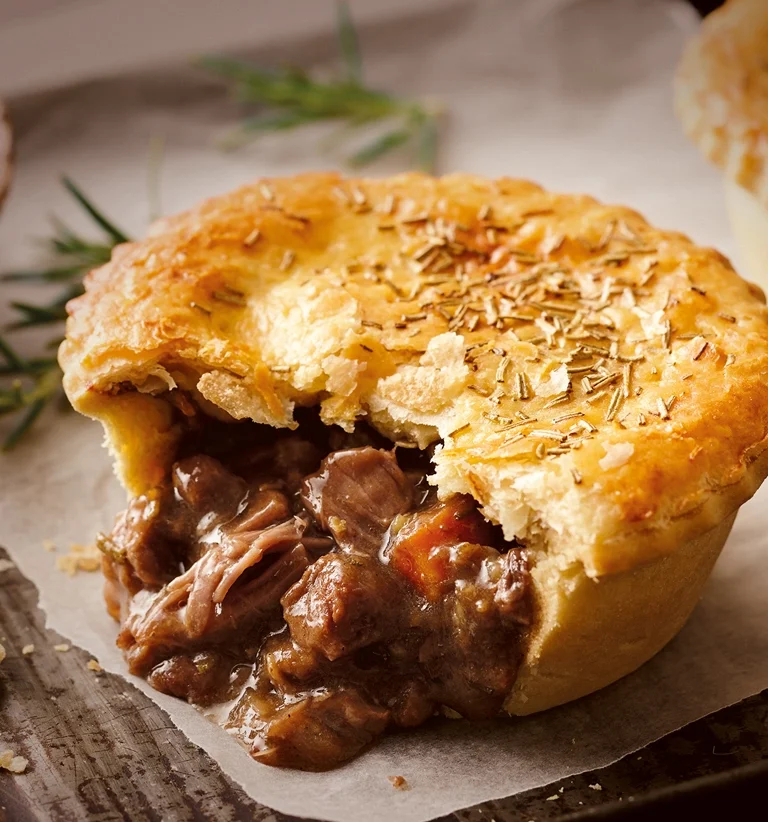 New Zealand meat pie, homemade Austrie Meat Pie with savory beef filling and flaky pastry, traditional Kiwi comfort food australian cuisine world cuisine recipes aussie cuisine