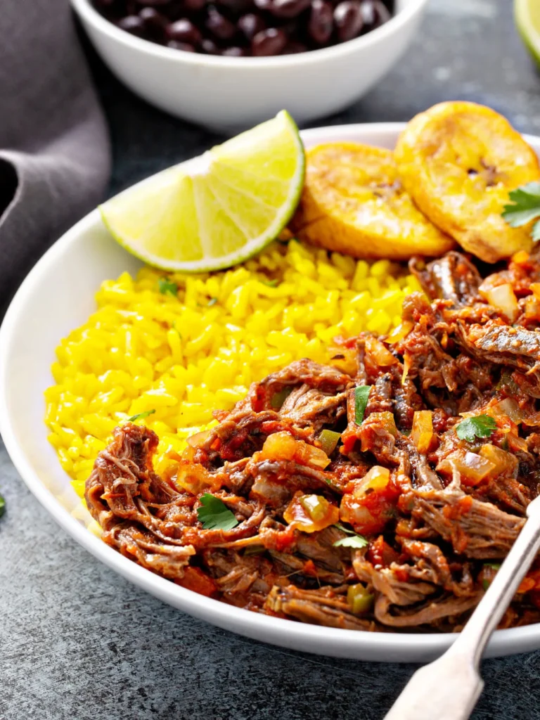 Authentic Cuban ropa vieja, Traditional Cuban stew, Ropa vieja recipe, Cuban shredded beef, Classic Caribbean cuisine, Cuban comfort food, Slow-cooked beef stew, Latin American culinary heritage, Savory shredded meat dish, Cuban family recipes