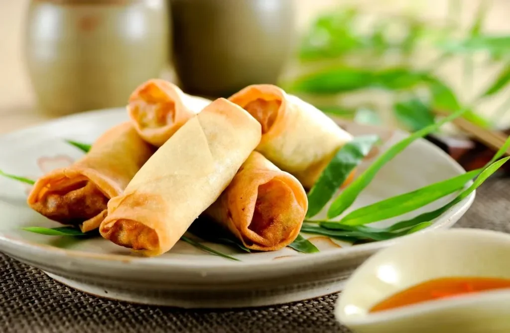 Authentic Recipe Chinese spring rolls Homemade Authentic spring roll recipe Traditional Cuisine Homemade spring rolls Crispy Texture Crispy spring rolls Fresh Vegetables Vegetable spring rolls Easy Preparation Chinese appetizers Flavorful Traditional Chinese cuisine Step-by-Step Guide Easy spring roll recipe Dipping Sauce How to make spring rolls Golden-Brown Asian finger foods Healthy Option Savory spring roll filling Popular Snack Dipping sauce for spring rolls Versatile Dish Golden-brown spring rolls Party Favorite Healthy spring roll options Crave-Worthy Popular Chinese snacks