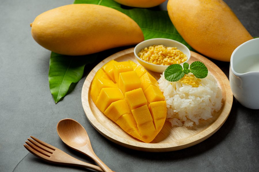 "Close-up of homemade mango sticky rice with fresh mango slices" "Traditional Thai mango sticky rice served with coconut sauce" "Plate of authentic Thai mango sticky rice dessert" "Bowl of sticky rice topped with ripe mango and sesame seeds" "Thai street food vendor preparing mango sticky rice" "Glutinous rice soaking in water for mango sticky rice" "Fresh mangoes sliced for Thai sticky rice dessert" "Coconut milk being poured over sticky rice" "Ingredients for making Thai mango sticky rice" Authentic Thai mango sticky rice recipe How to make mango sticky rice at home Traditional Thai dessert recipes Easy Thai sticky rice with mango Best Thai desserts Thai street food recipes Healthy Thai dessert options Mango sticky rice ingredients Step-by-step mango sticky rice recipe Delicious Thai sweets